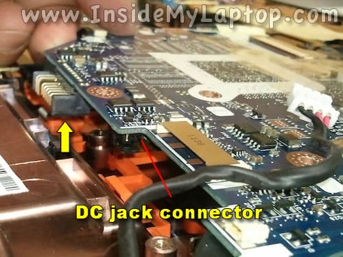 Lift up motherboard and plug in DC jack