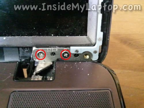 Loosen two screws in lower right corner