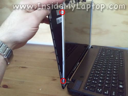 Remove two screws from left bracket