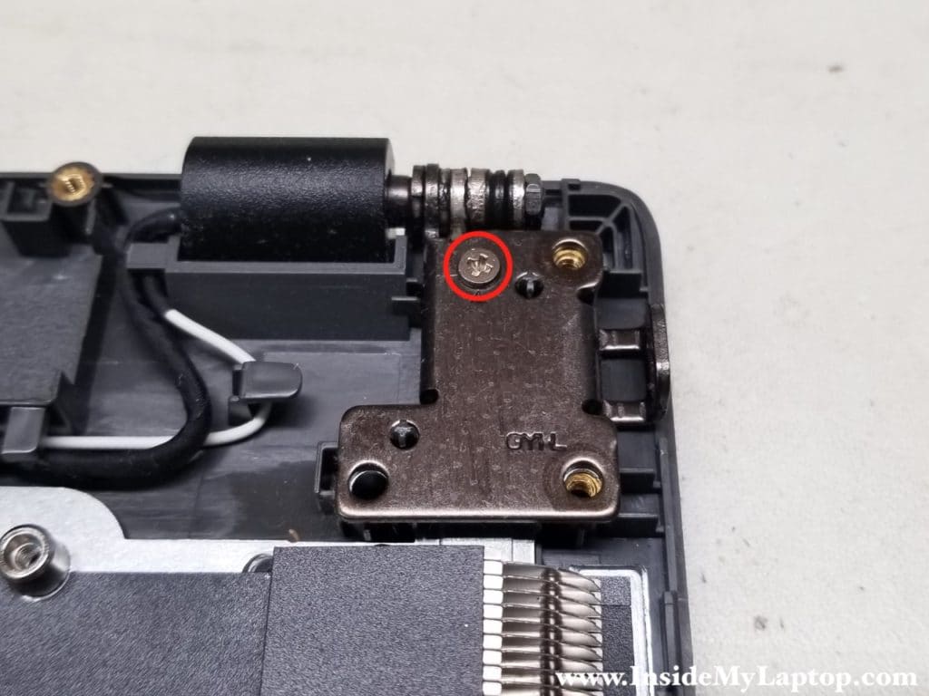 Remove screw from left hinge