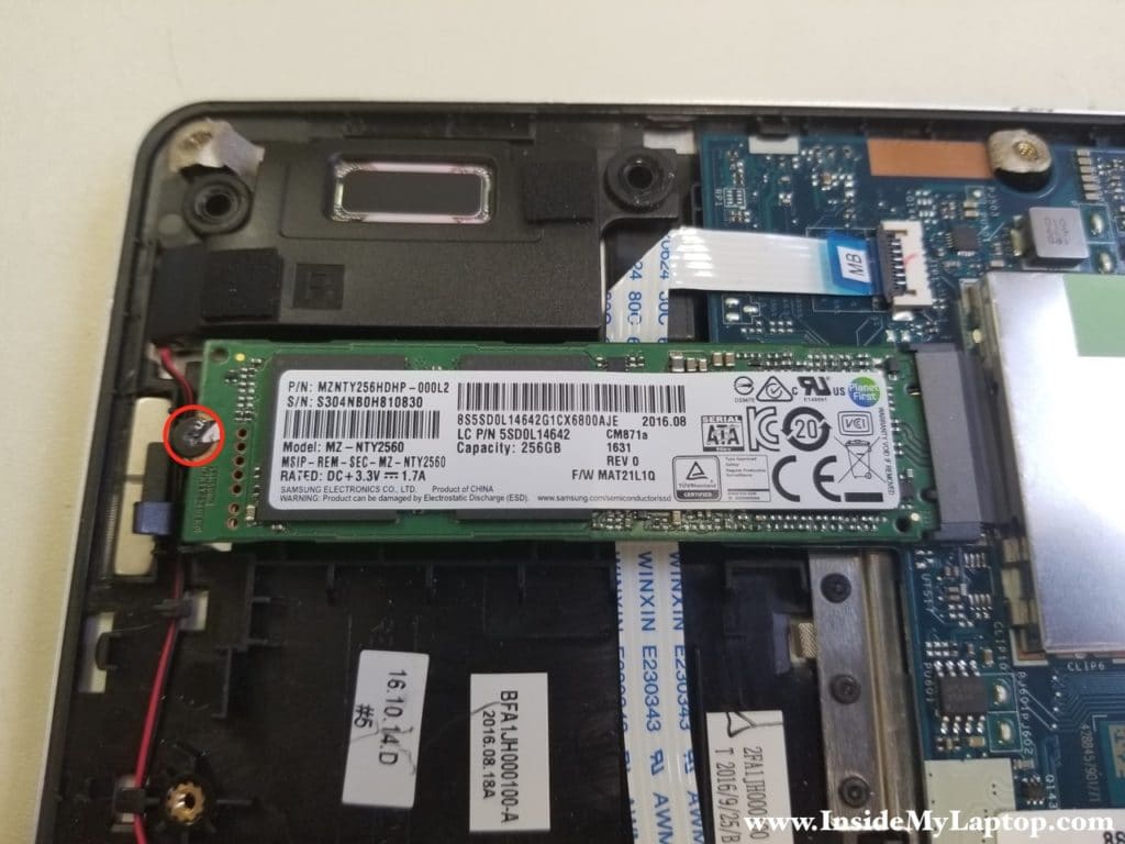 Remove screws securing SSD