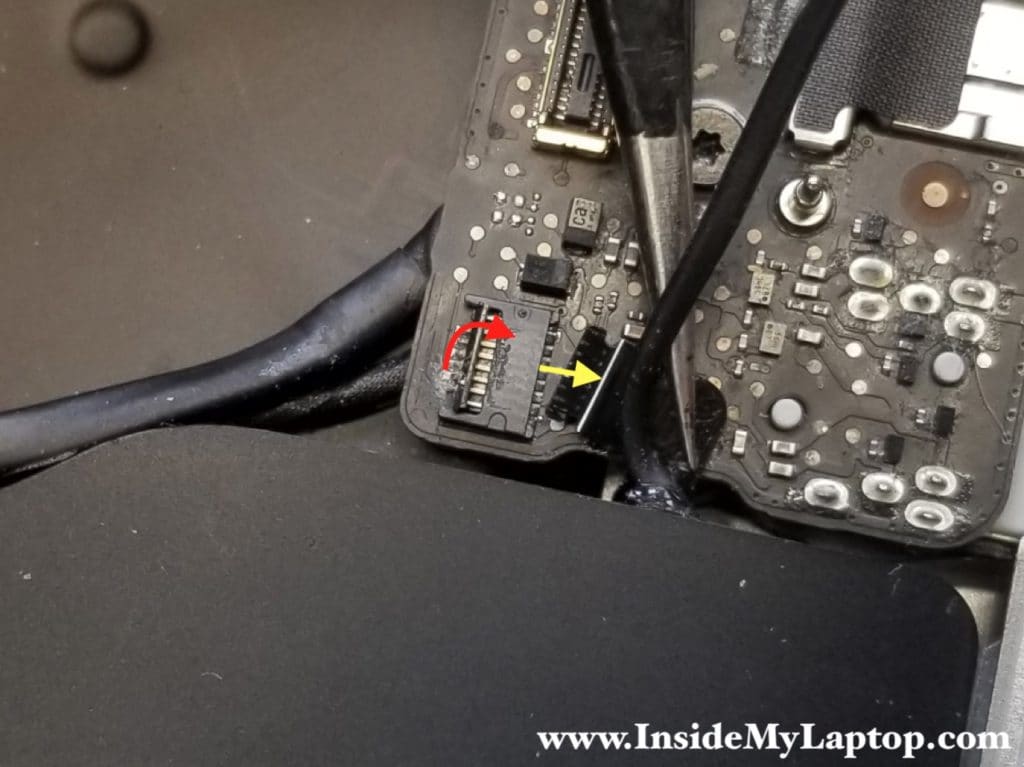 Unlock connector and remove microphone cable