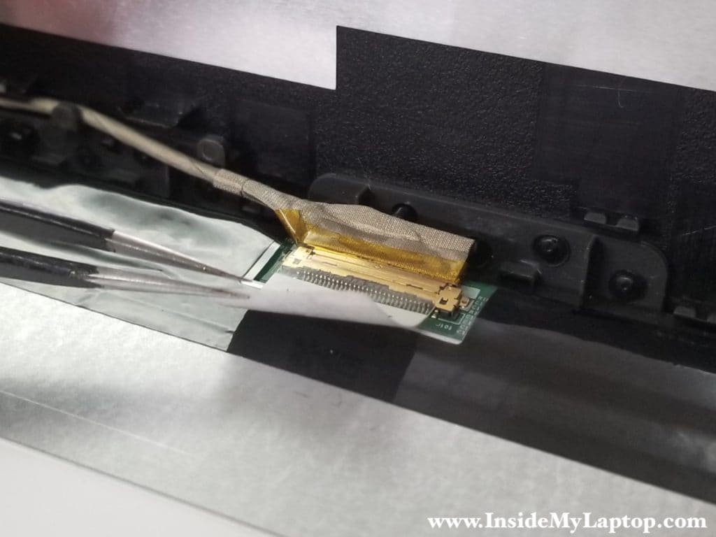 Peel off clear tape from the connector