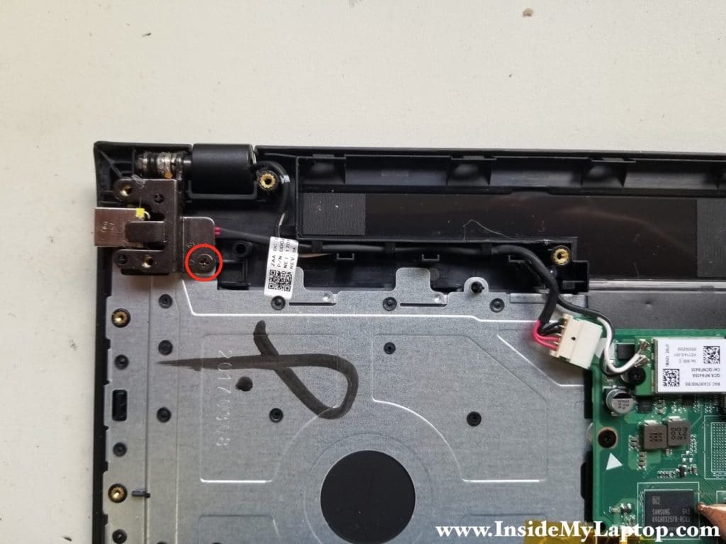 Remove screw from right hinge