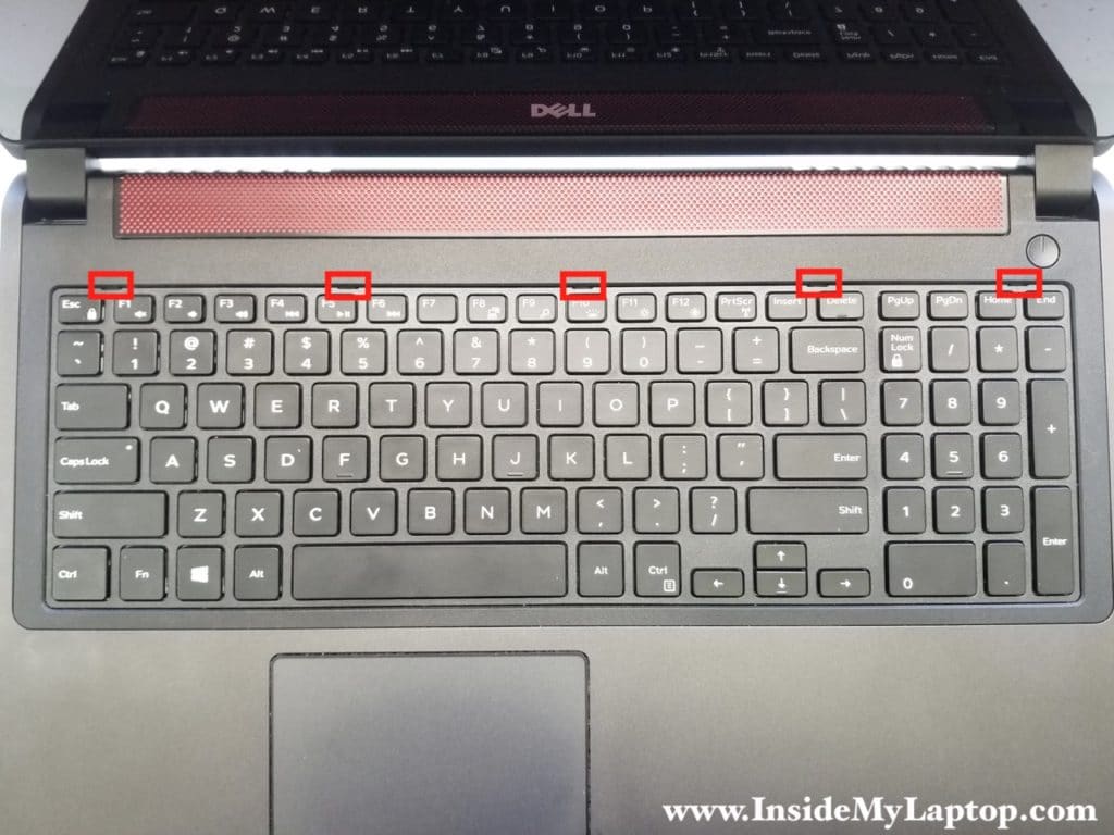 Five latches securing keyboard to top case