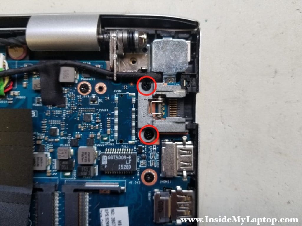 Remove screws from Ethernet bracket