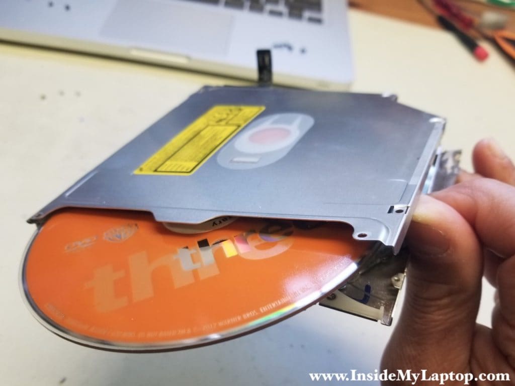 Remove stuck DVD from optical drive