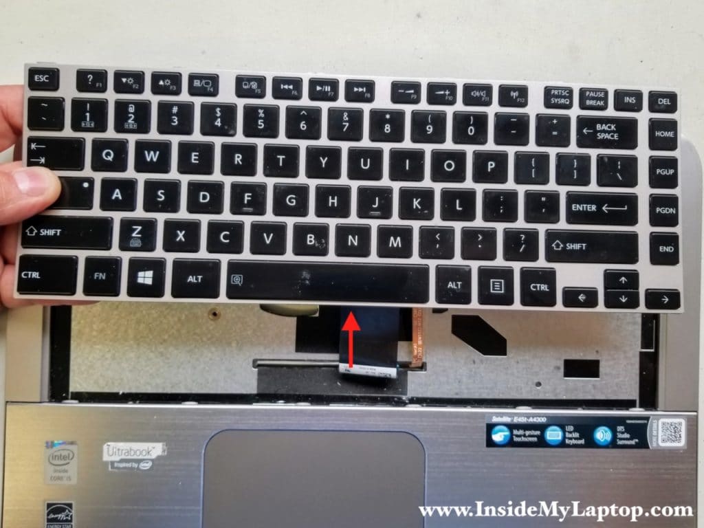 Pull keyboard cables through opening in top case