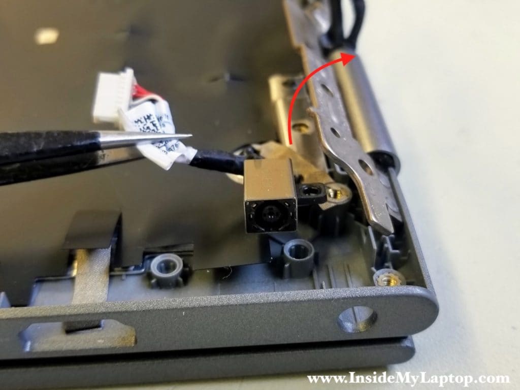 Open up hinge and remove DC jack