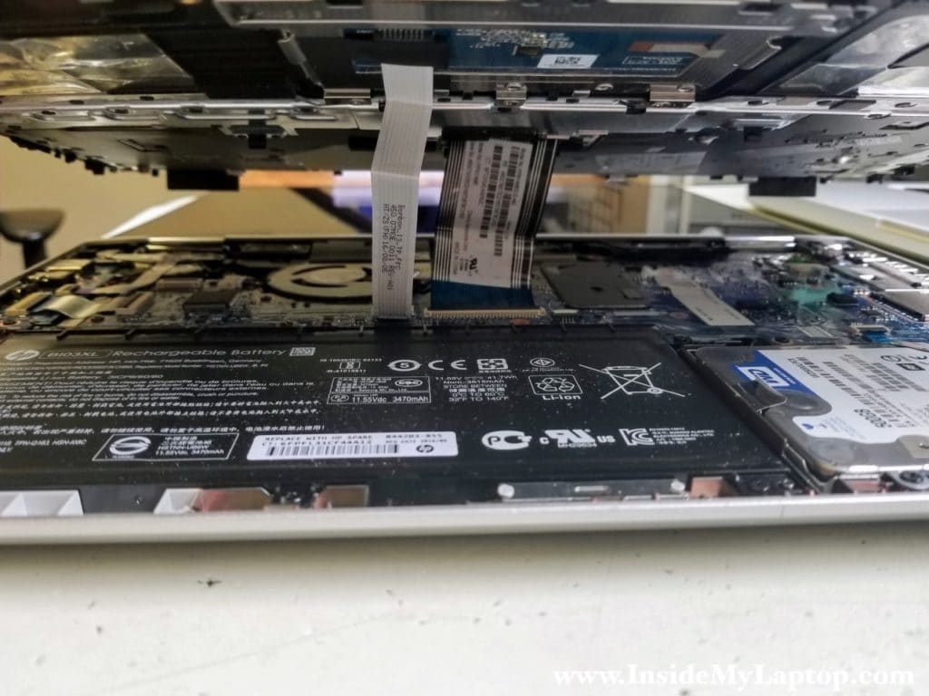 Top case has two cables connected to motherboard
