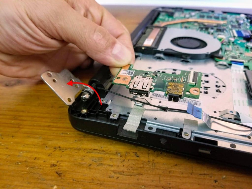Open up the display hinge and remove the USB audio board.