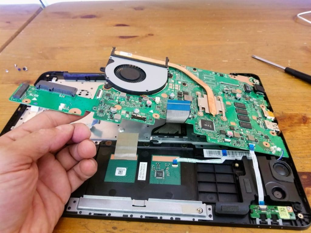 Separate the motherboard from the palrmest assembly and remove it.