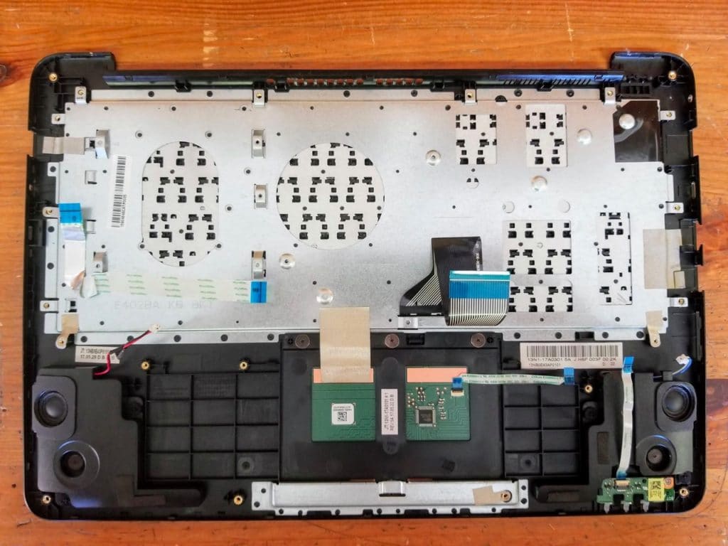 The keyboard is permanently attached to the palmrest but the touchpad can be removed and replaced.