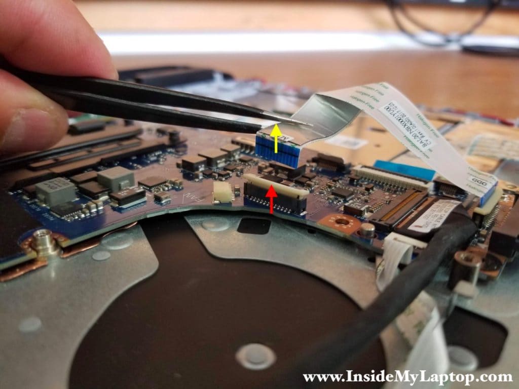 How to disconnect optical drive connector board cable