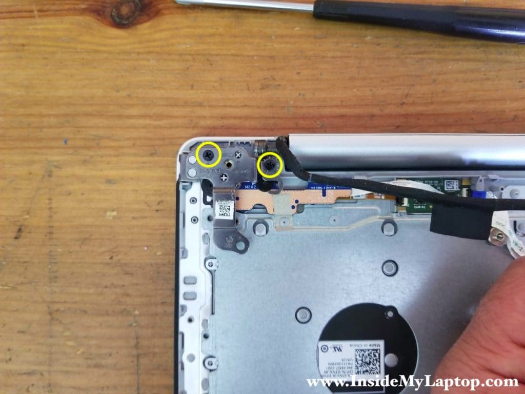 Remove two screws from right hinge