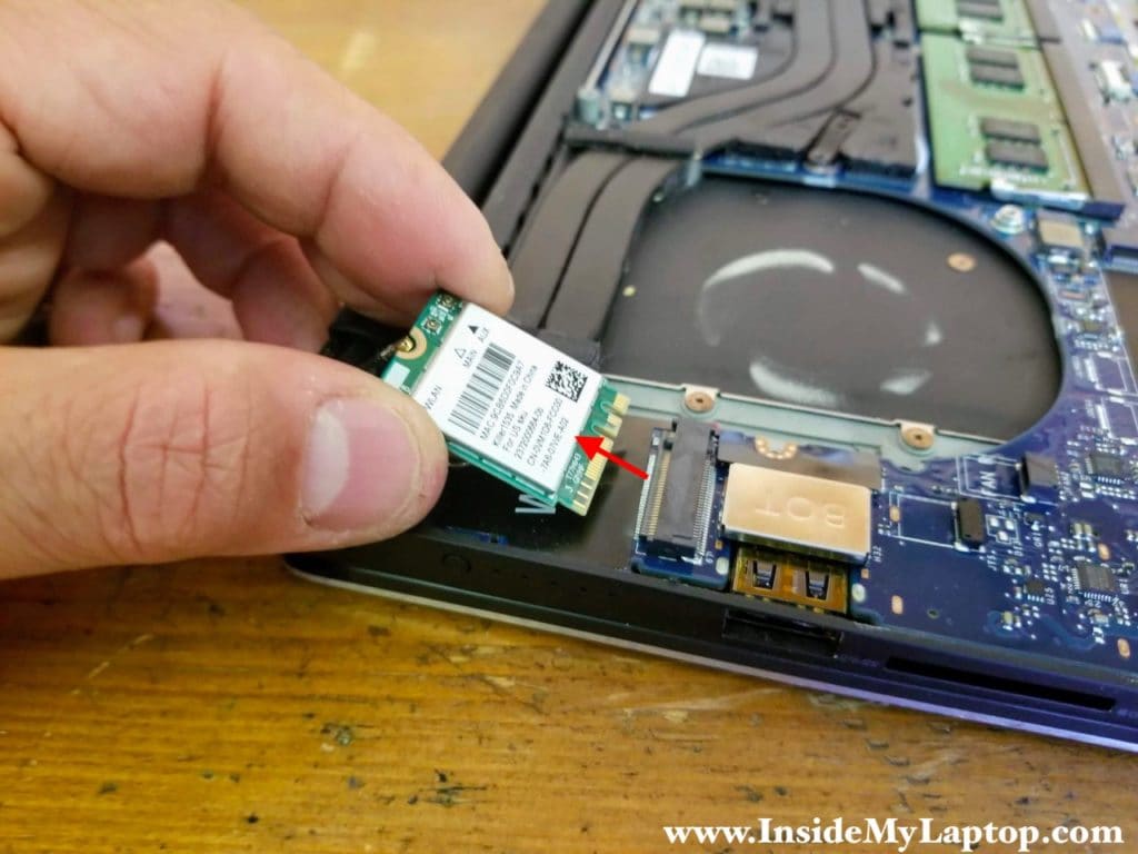 Pull the wireless card out and remove it.