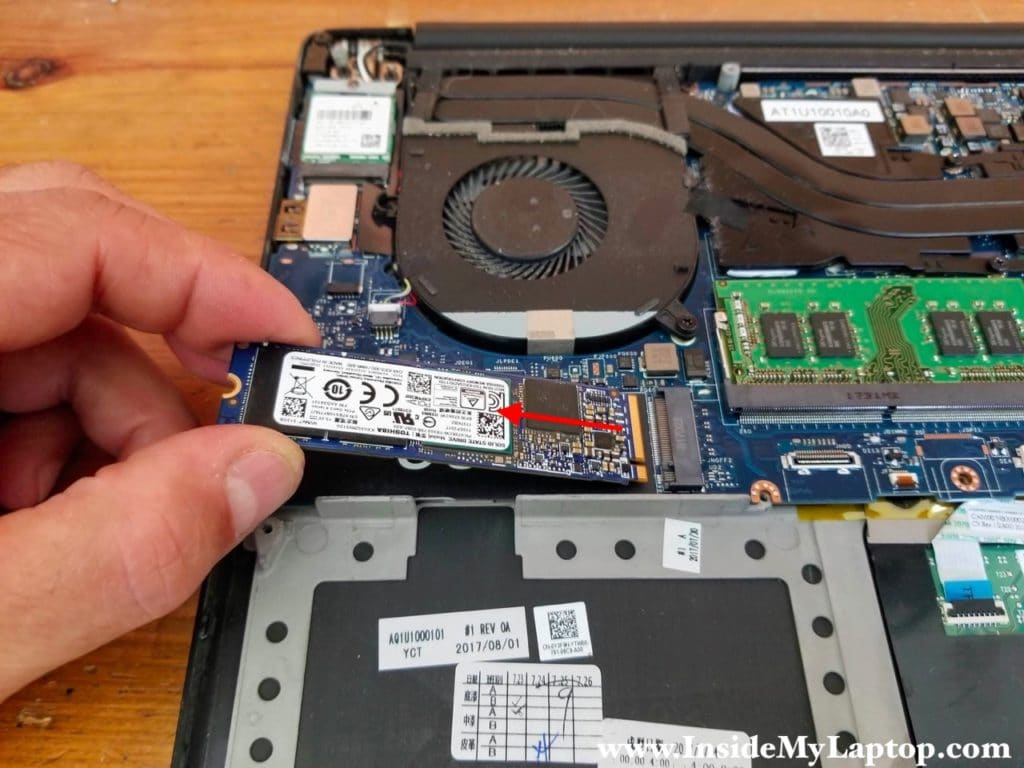 Remove one screw securing the solid stat drive and pull the SSD out.