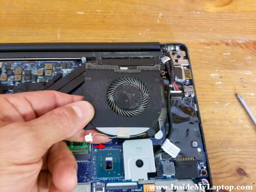 Remove the left cooling fan and disconnect it from the motherboard.