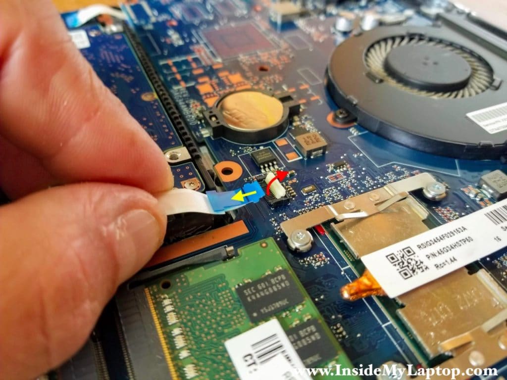 Unlock the connector first and pull the SATA cable out.