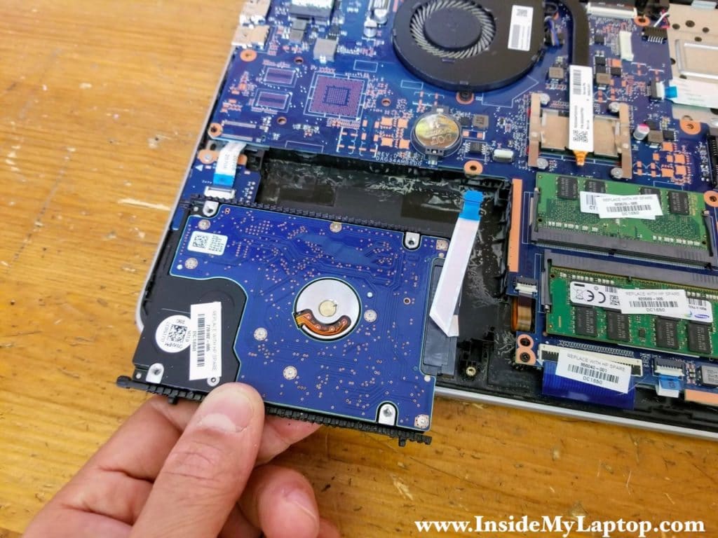 Remove the hard drive assembly with the SATA cable attached to it.