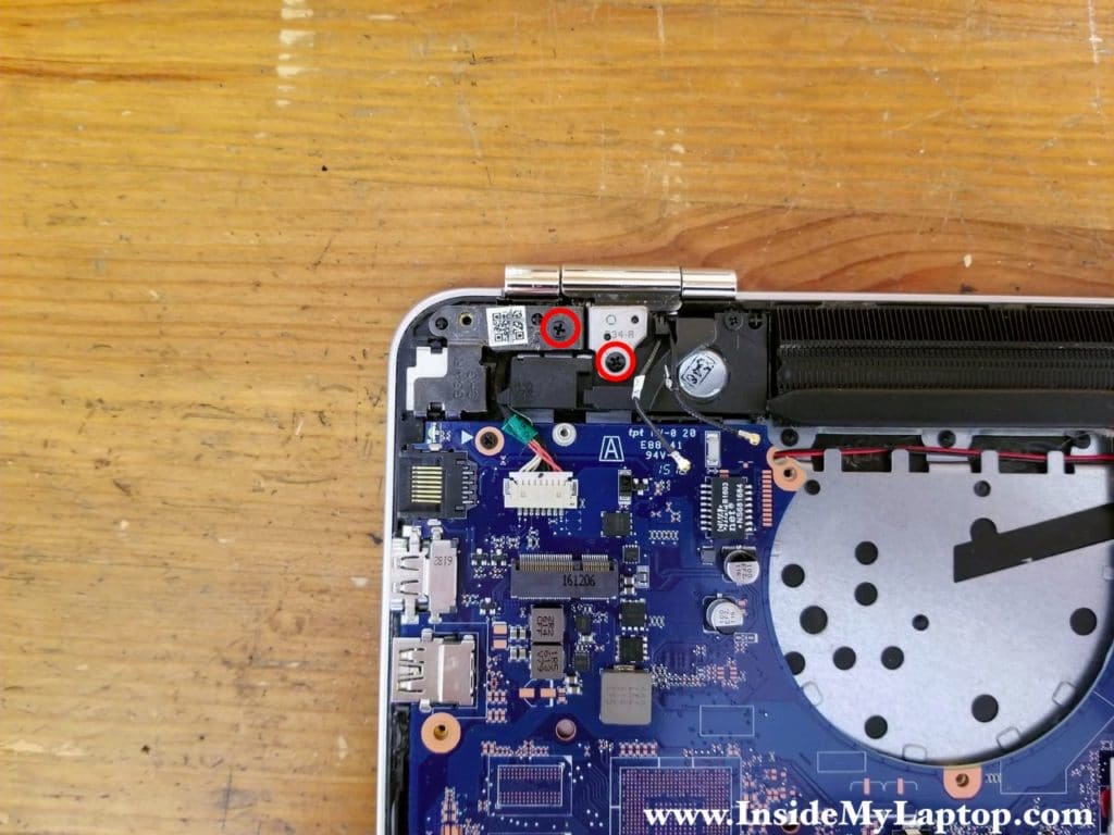 Remove two screws from the right display hinge.
