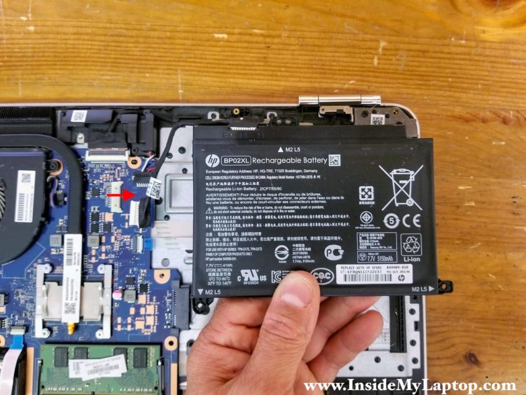 Lift up the battery and disconnect it from the motherboard.