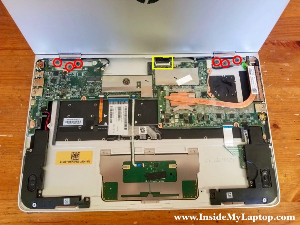 Disconnect the display video cable from the motherboard and remove six screws securing display hinges.