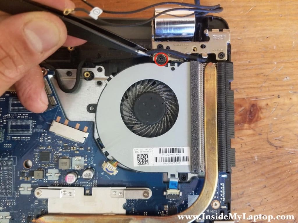 Remove one screw securing cooling fan