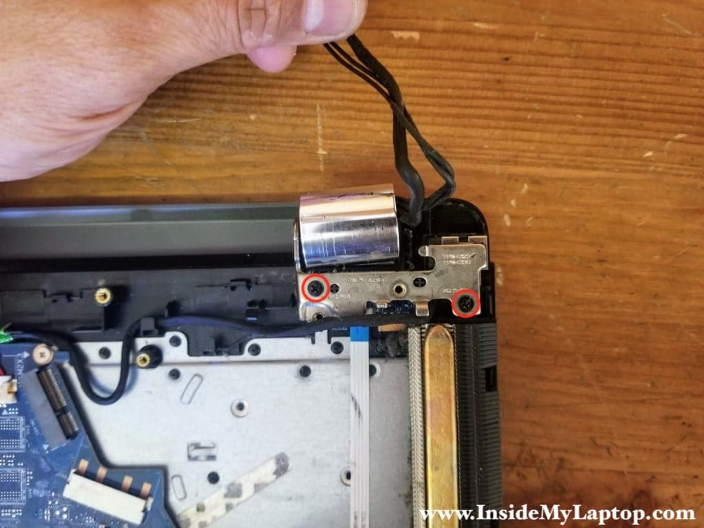 Remove two screws from left hinge