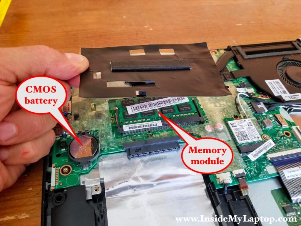 Accessing laptop memory module and CMOS battery.