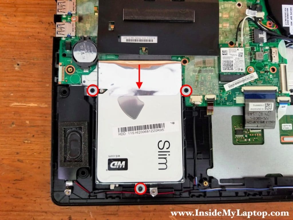 Remove three screws from the hard drive mounting bracket and disconnect it from the SATA port.