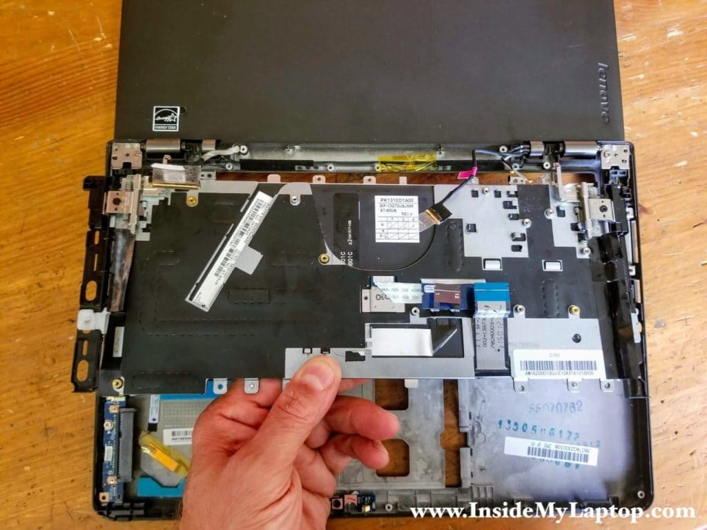 Lift up the keyboard assembly and remove it from the rest of the laptop.