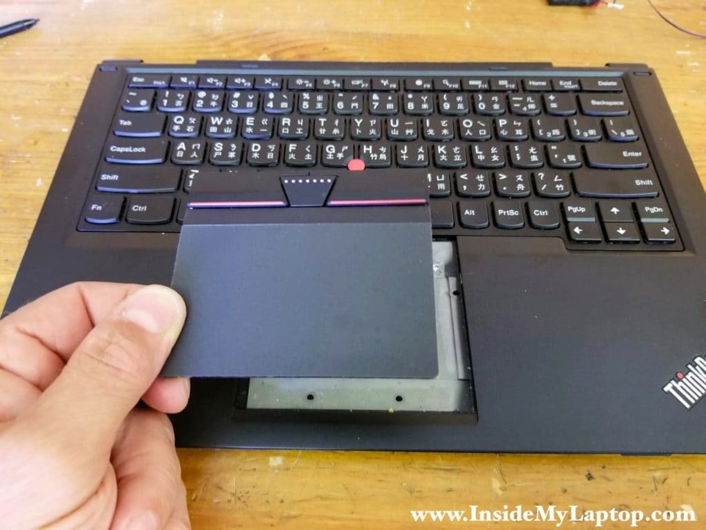 Remove the touchpad.