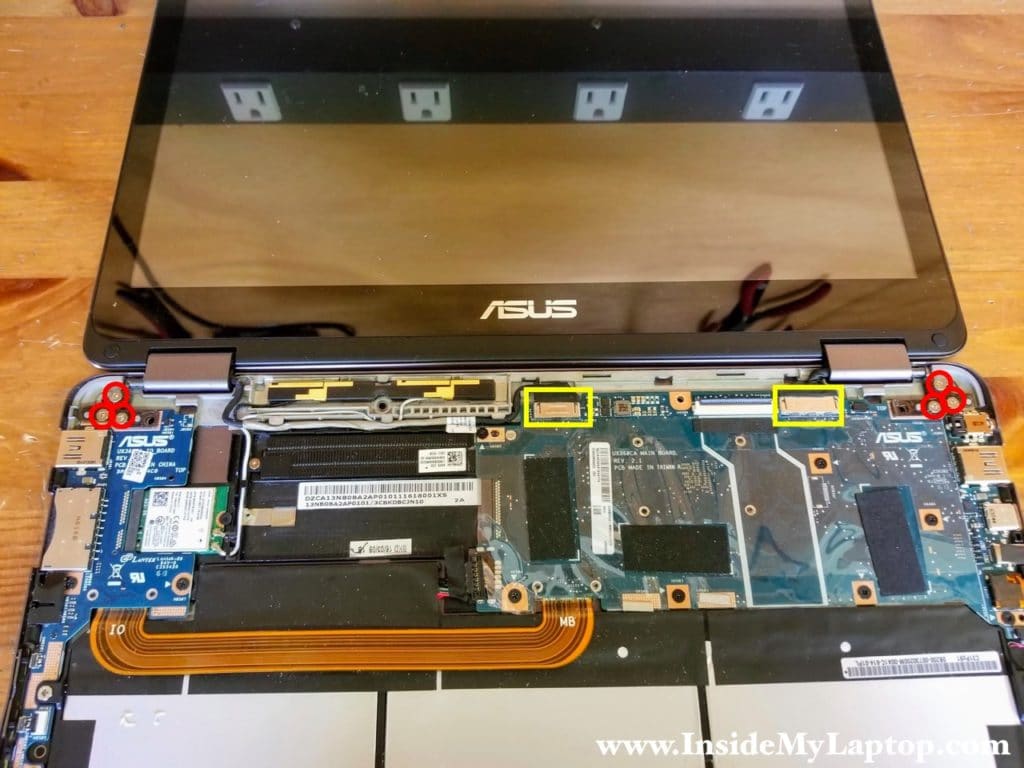 Remove six screws from display hinges and disconnect two cables.