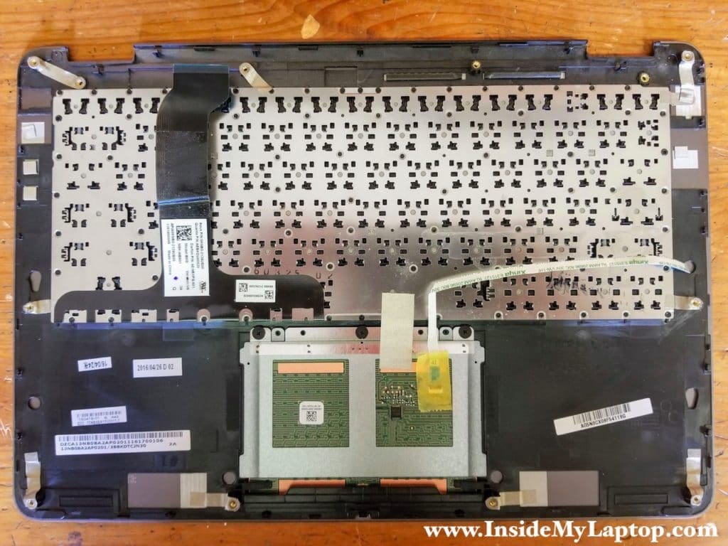 Here's a photo of the bottom side of the top case (palmrest/keyboard/touchpad) assembly.