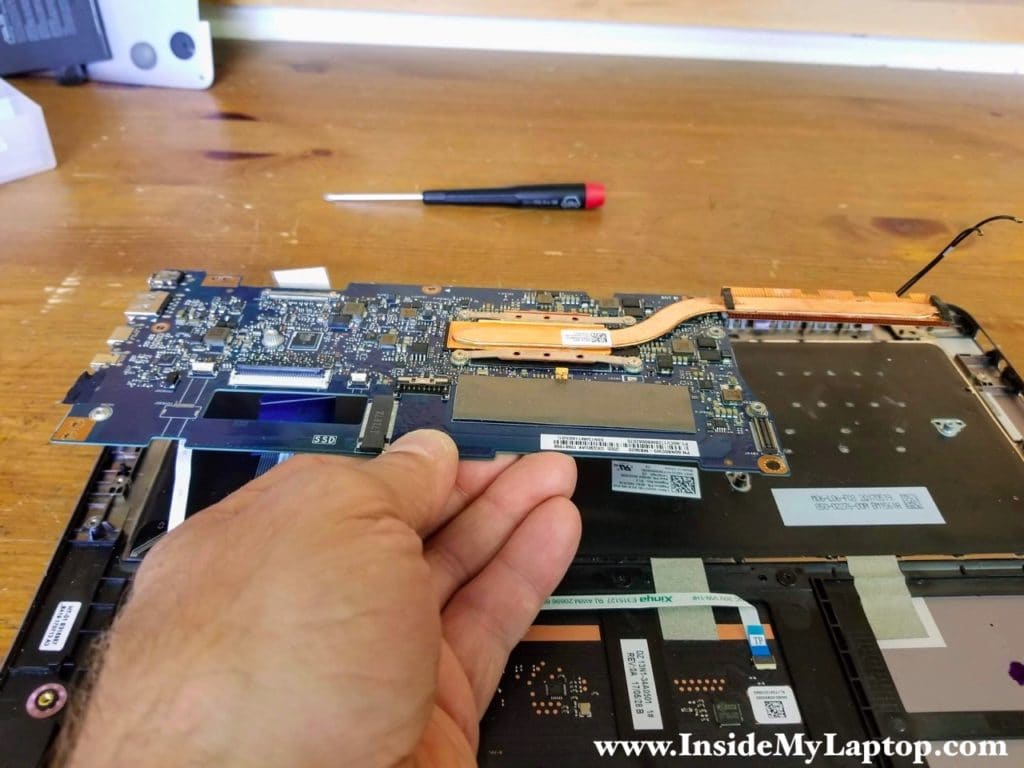 Remove the motherboard from the top case assembly.