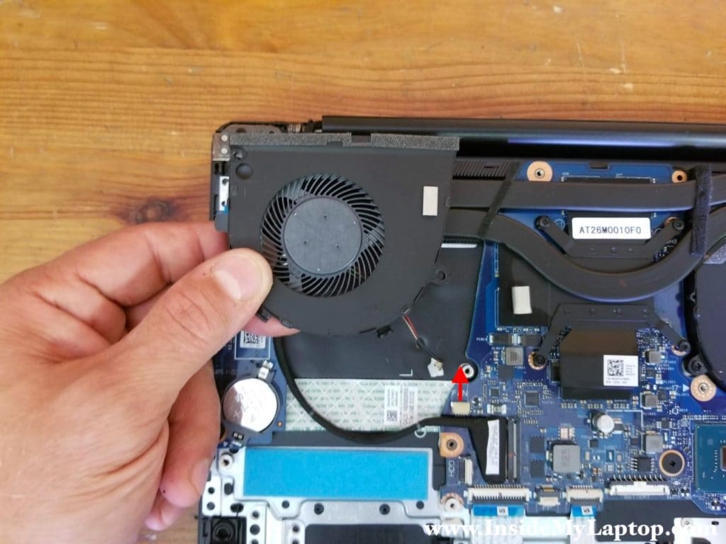 Lift up the right fan and disconnect it from the motherboard.