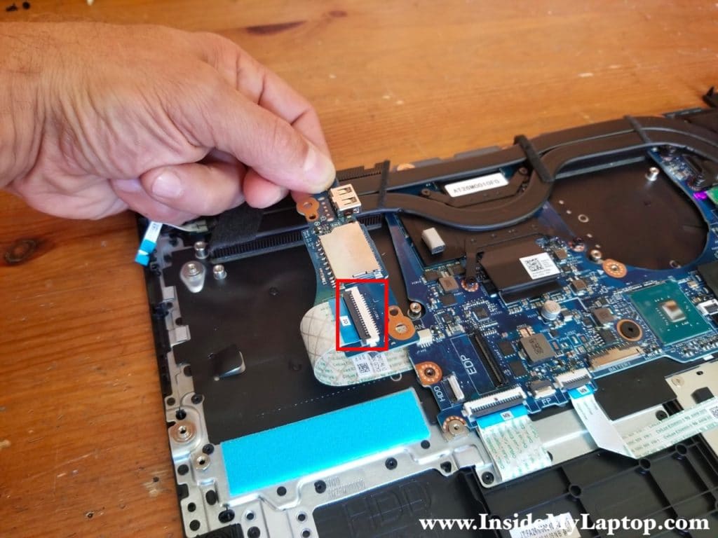 Disconnect the I/O cable on the other side of the USB SD card reader board.