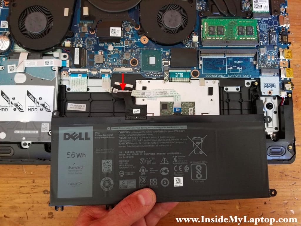 Lift up the battery and disconnect it from the motherboard.