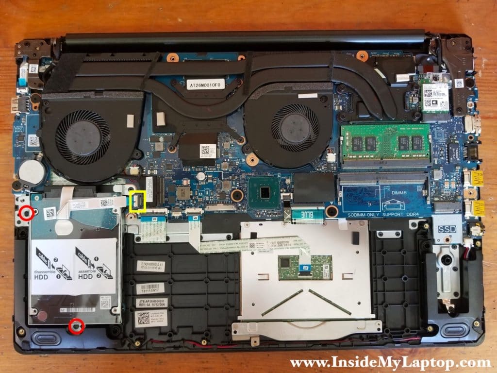 Remove two screws from the hard drive bracket and disconnect the hard drive SATA cable from the motherboard.