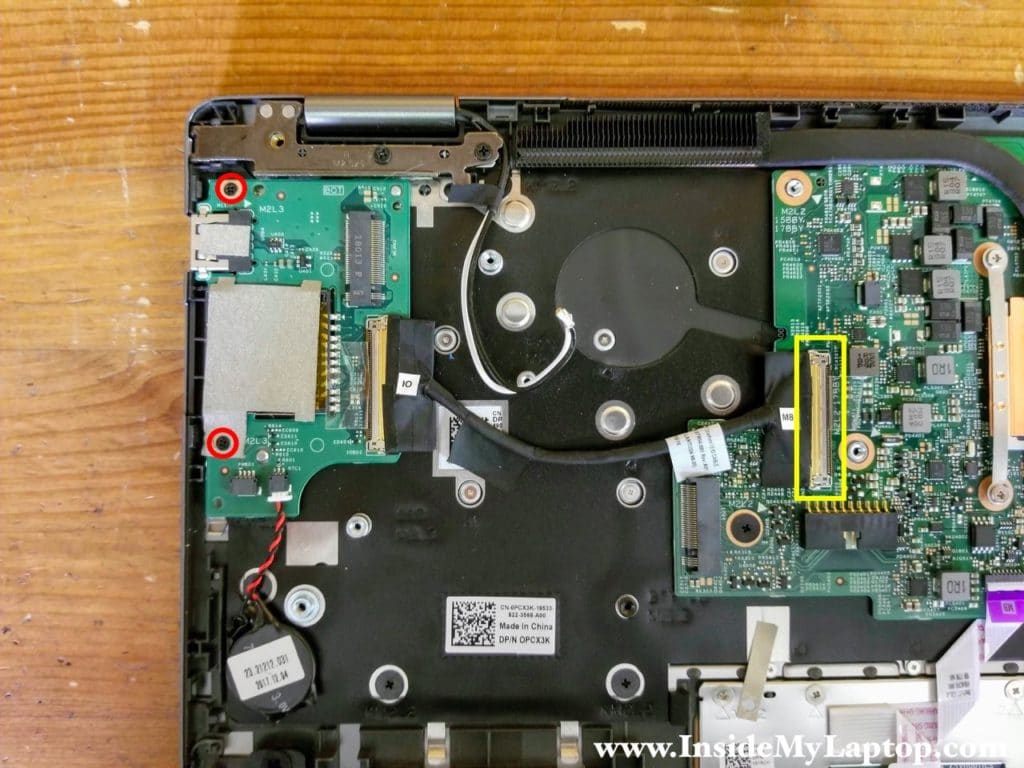 Remove two screws securing the I/O board (USB SD card reader) and disconnect the cable.