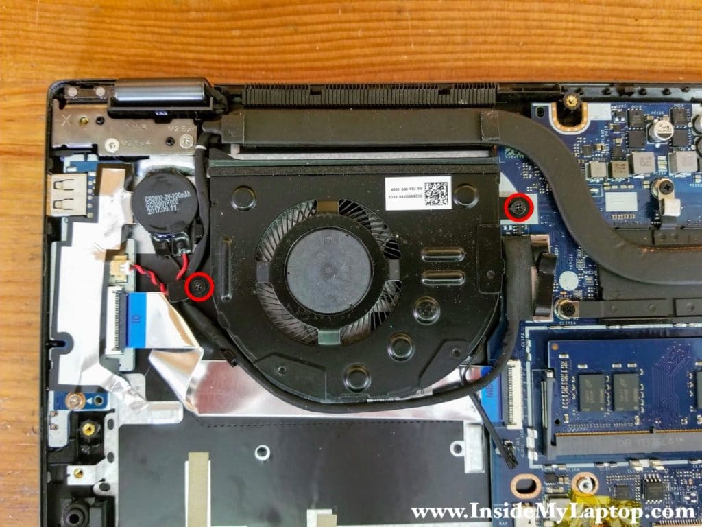 Remove two screws from the cooling fan.