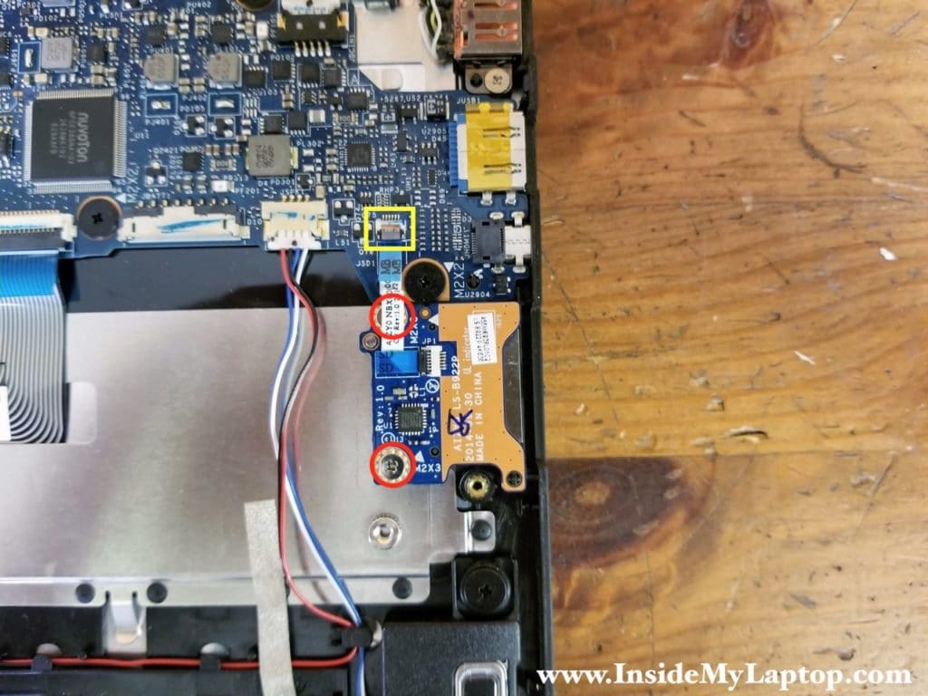 Disconnect the SD card reader cable from the motherboard. Remove two screws securing the SD card reader board.