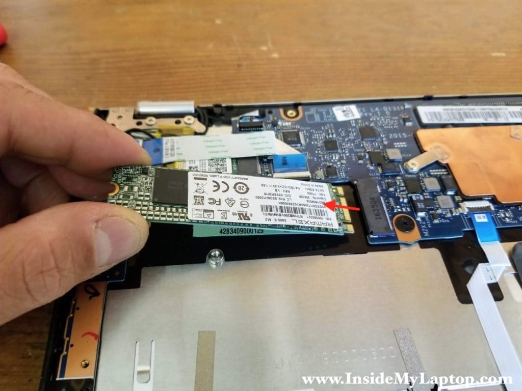 Remove one screw securing the SSD. Pull the SSD out.