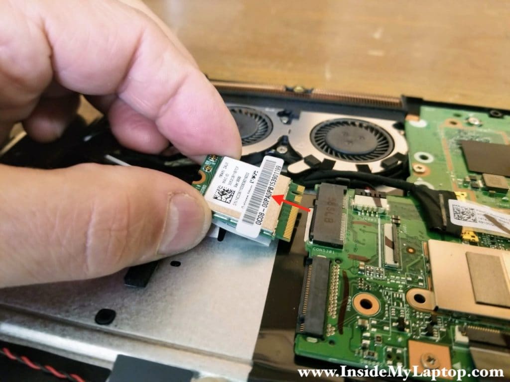 Remove one screw securing the wireless card and pull the card out.