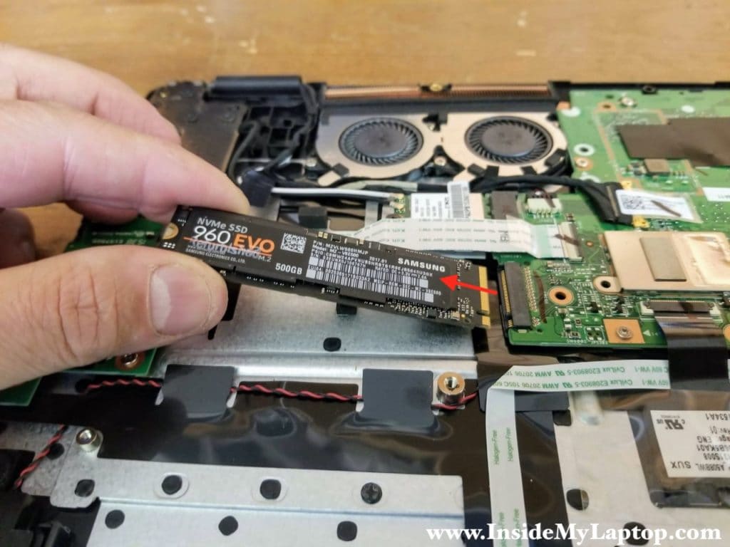 Remove one screw securing the solid state drive and pull the SSD out.