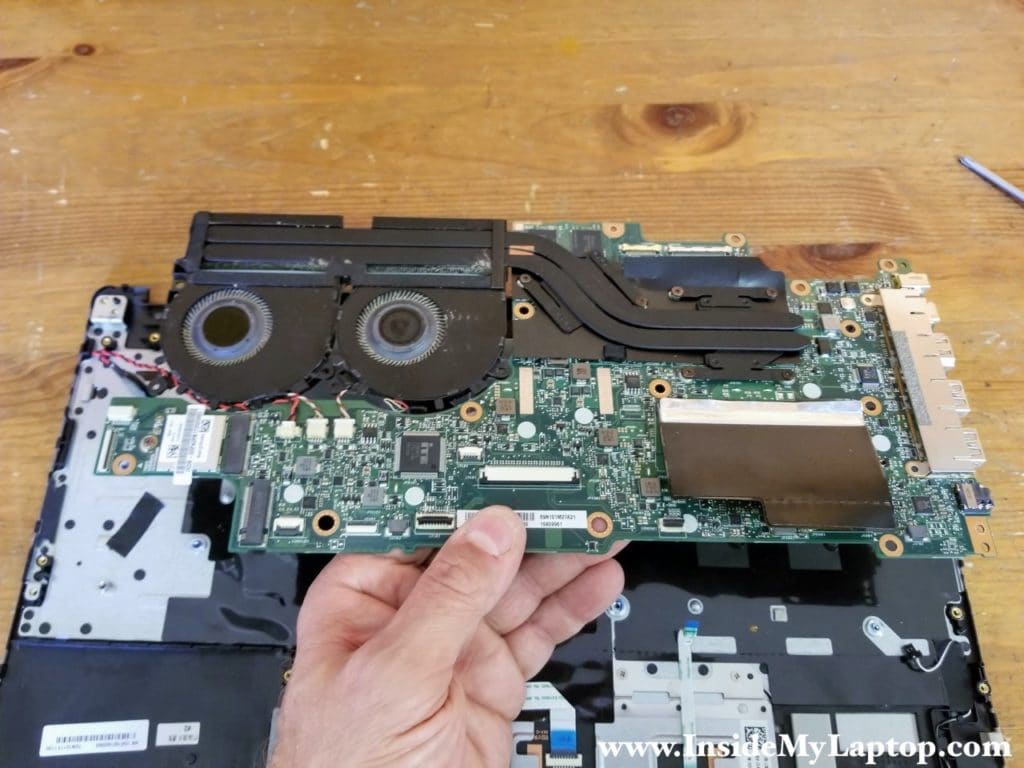 Separate the motherboard from the palmrest assembly and remove it.