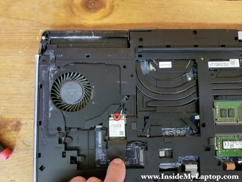 Remove one screw securing the wireless card.