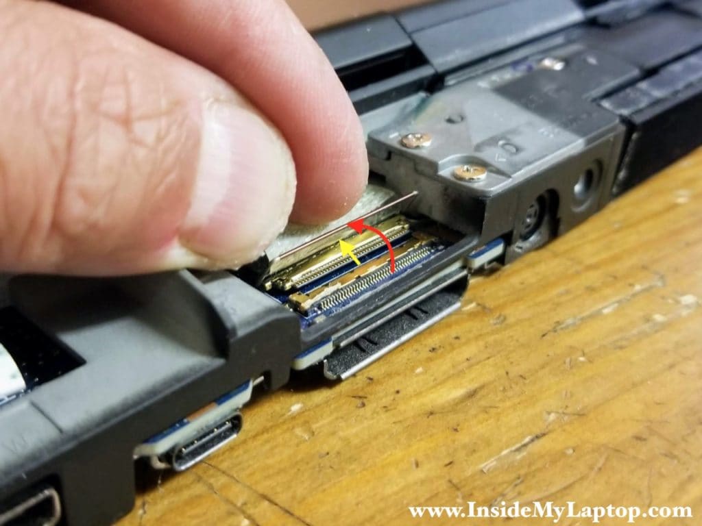 Unlock the display cable connector and pull the cable out.