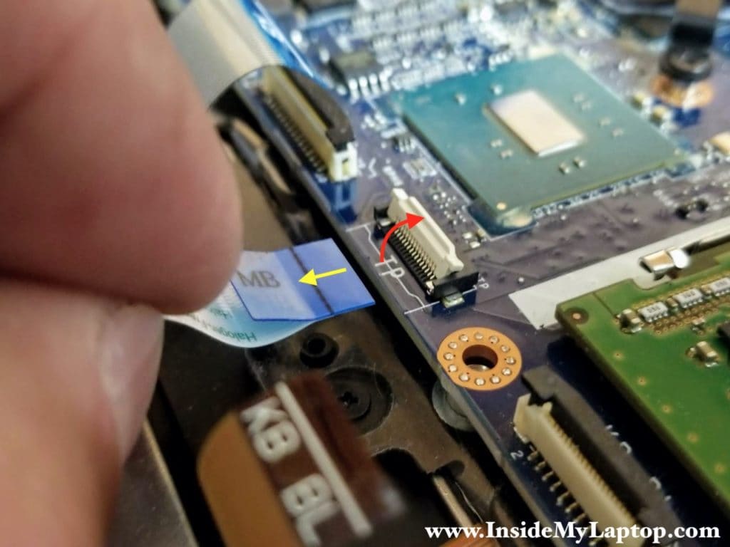 Here's how to disconnect the trackpad cable.